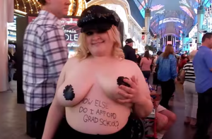 Gross Woman makes tips on Fremont Street from People that are making fun of Her